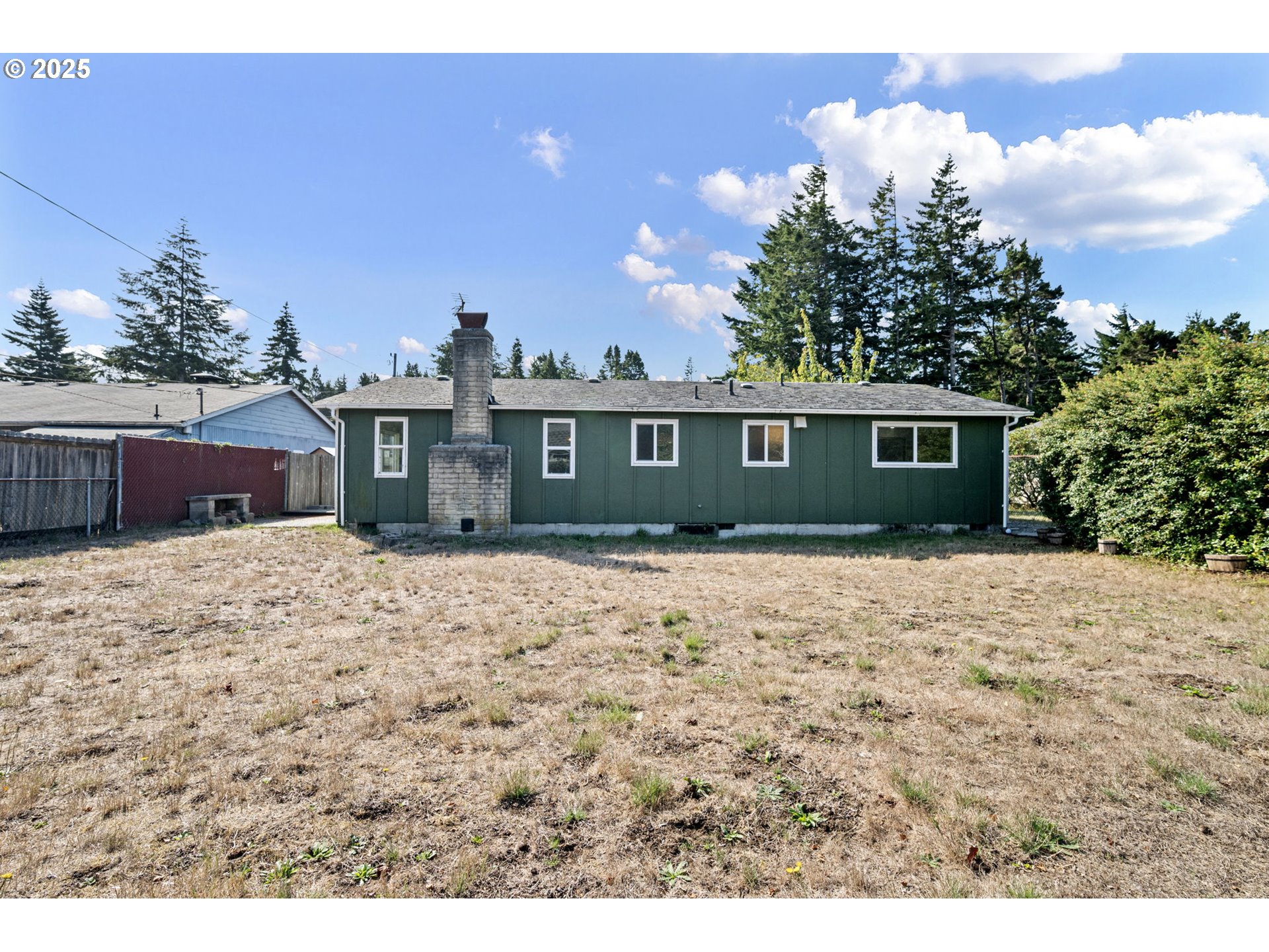2105 16th Street Florence, OR 97439 - Photo 43 of 48 a front view of a house with a yard