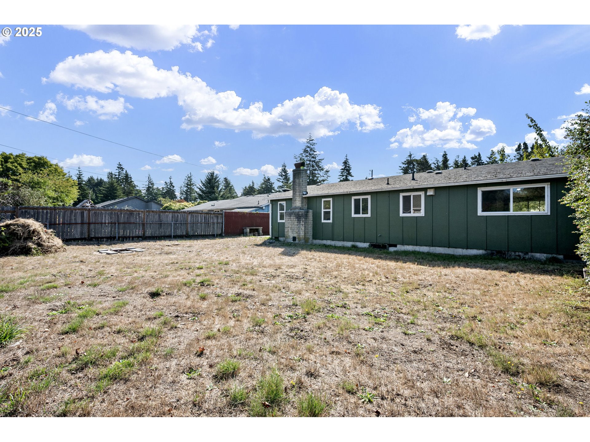 2105 16th Street Florence, OR 97439 - Photo 44 of 48 a front view of a house with a yard