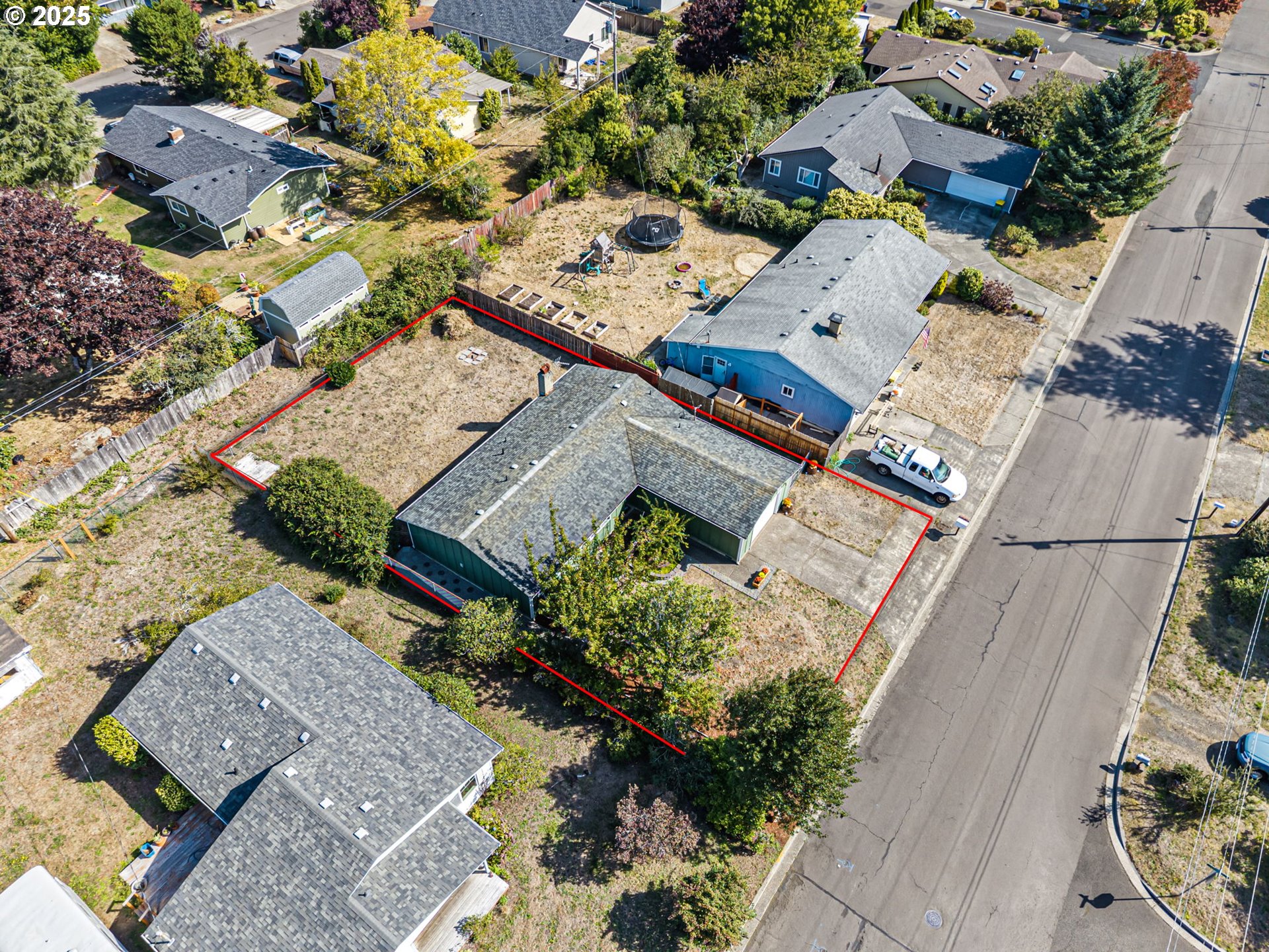 2105 16th Street Florence, OR 97439 - Photo 46 of 48 an aerial view of a house with a yard