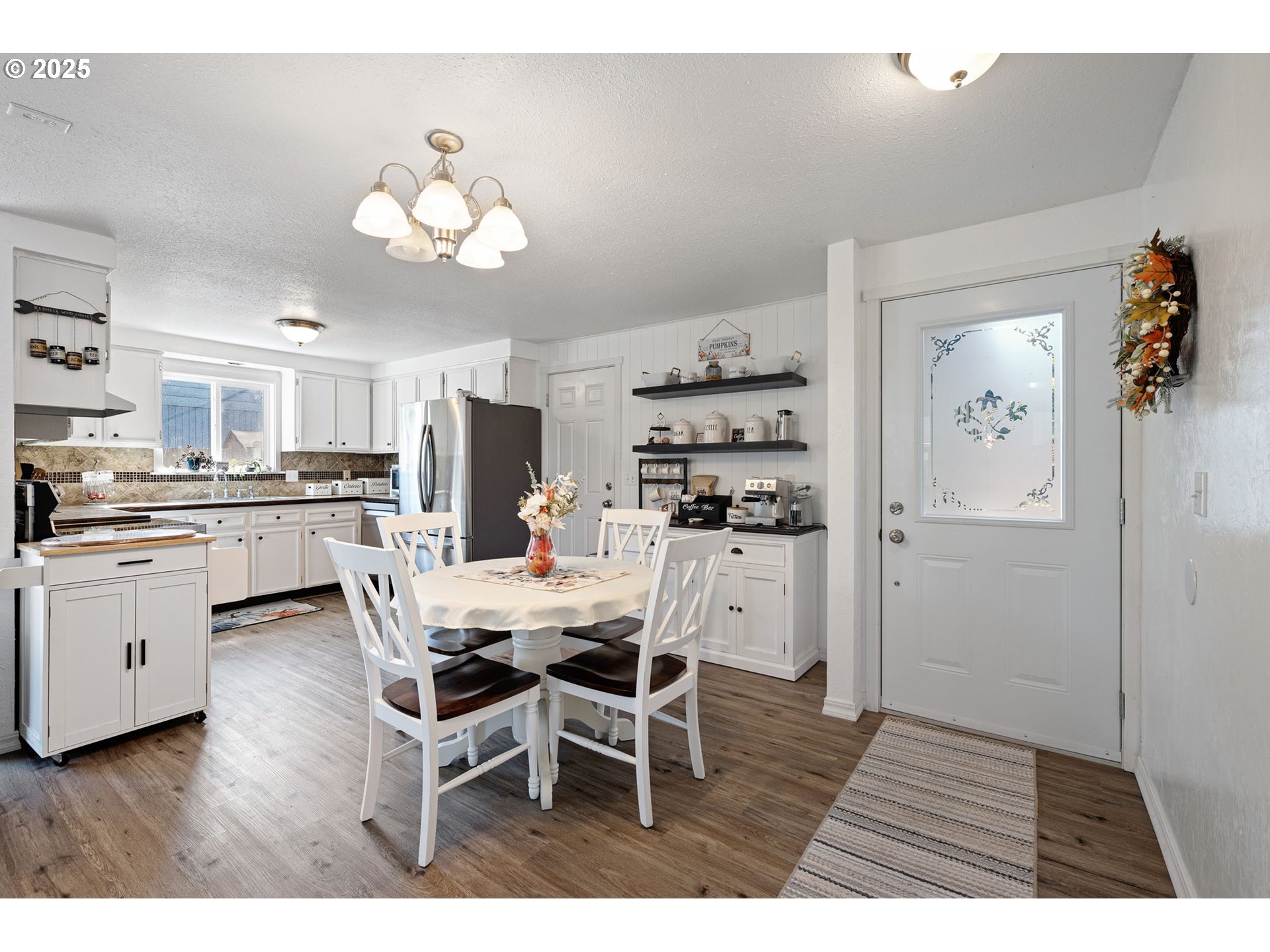 2105 16th Street Florence, OR 97439 - Photo 6 of 48 a open dining room with kitchen island stainless steel appliances furniture a chandelier and kitchen view