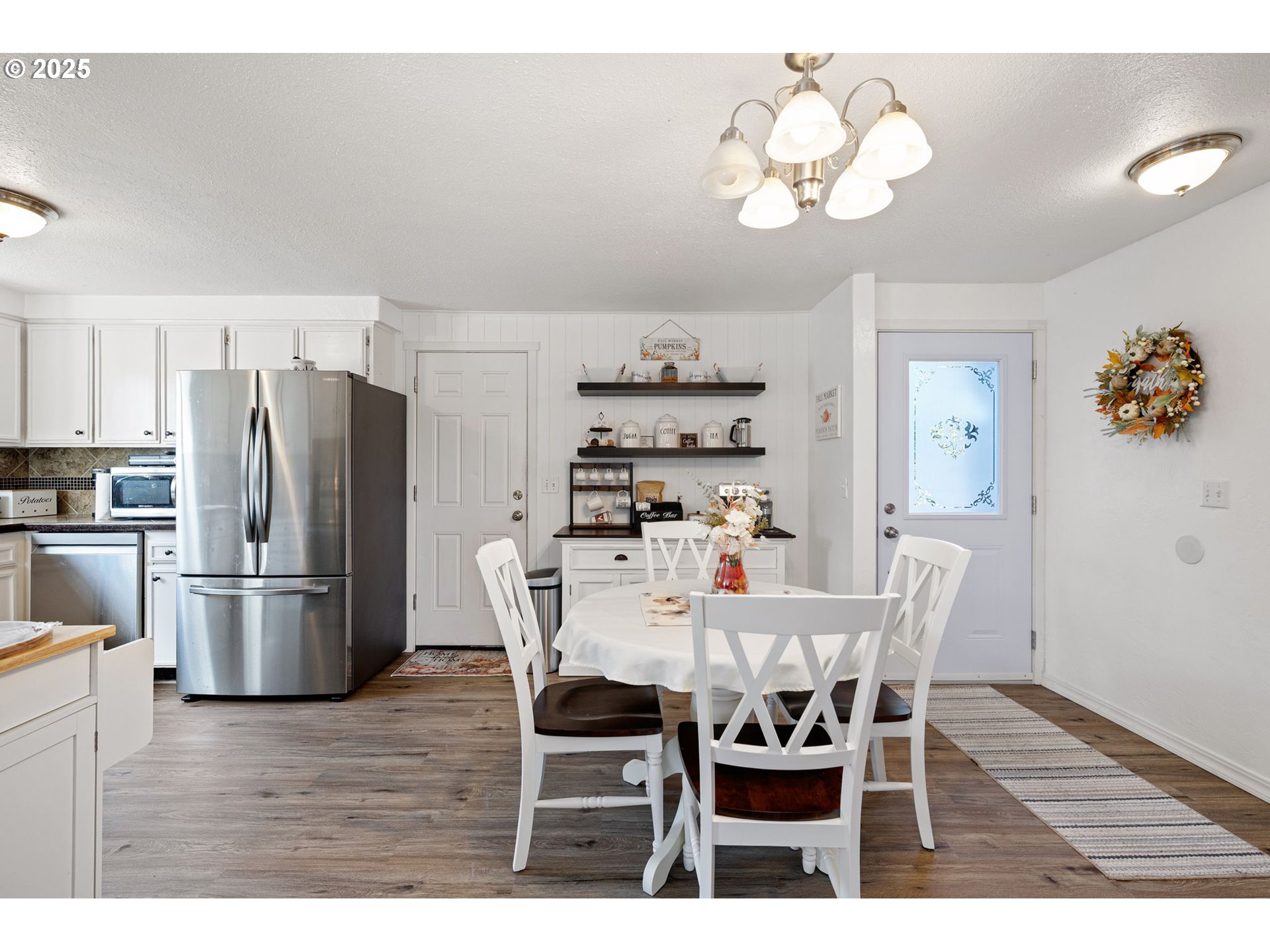 2105 16th Street Florence, OR 97439 - Photo 7 of 48 a view of a dining room with furniture and wooden floor