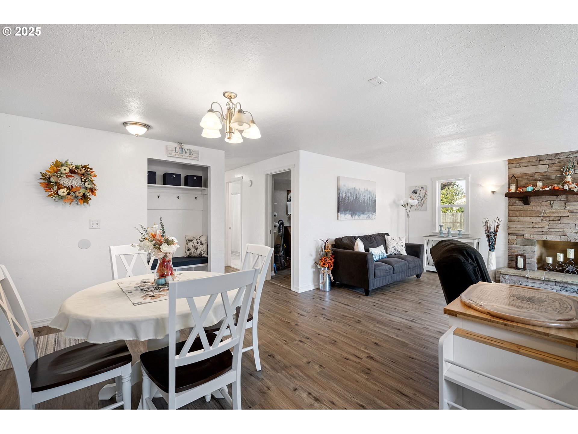 2105 16th Street Florence, OR 97439 - Photo 9 of 48 a view of a dining room with furniture and wooden floor