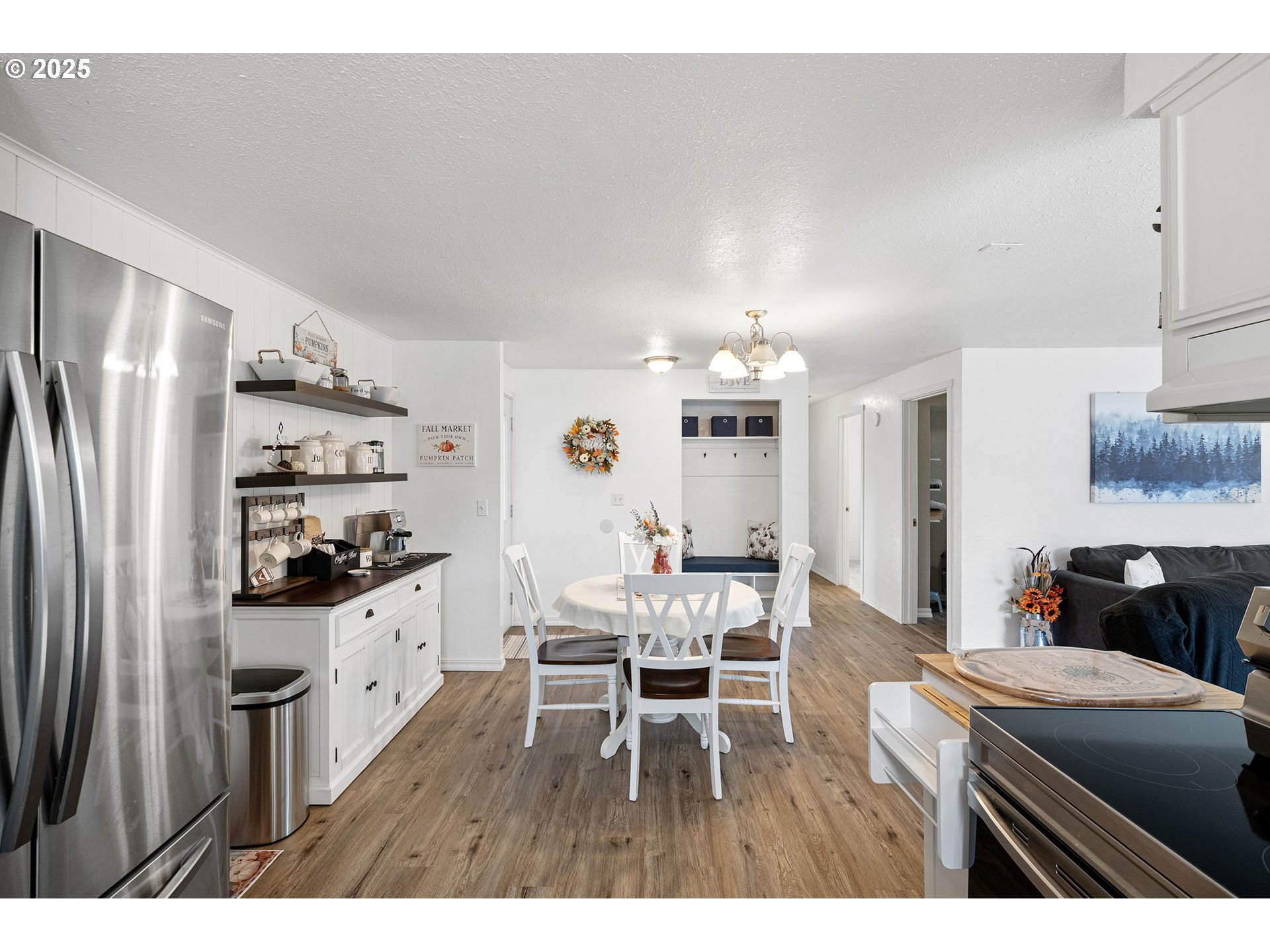 2105 16th Street Florence, OR 97439 - Photo 10 of 48 a kitchen with stainless steel appliances kitchen island granite countertop a refrigerator and a stove top oven