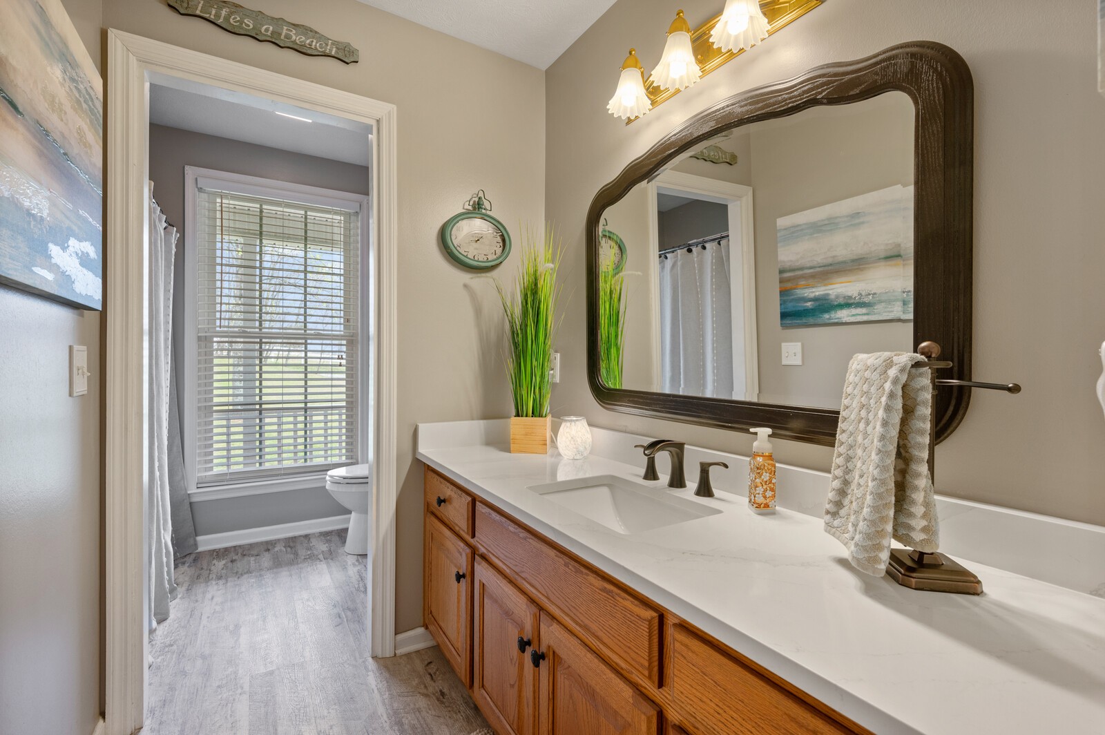 6388 Franklin Road Lebanon, TN 37090 - Photo 18 of 27 a bathroom with a sink and a mirror