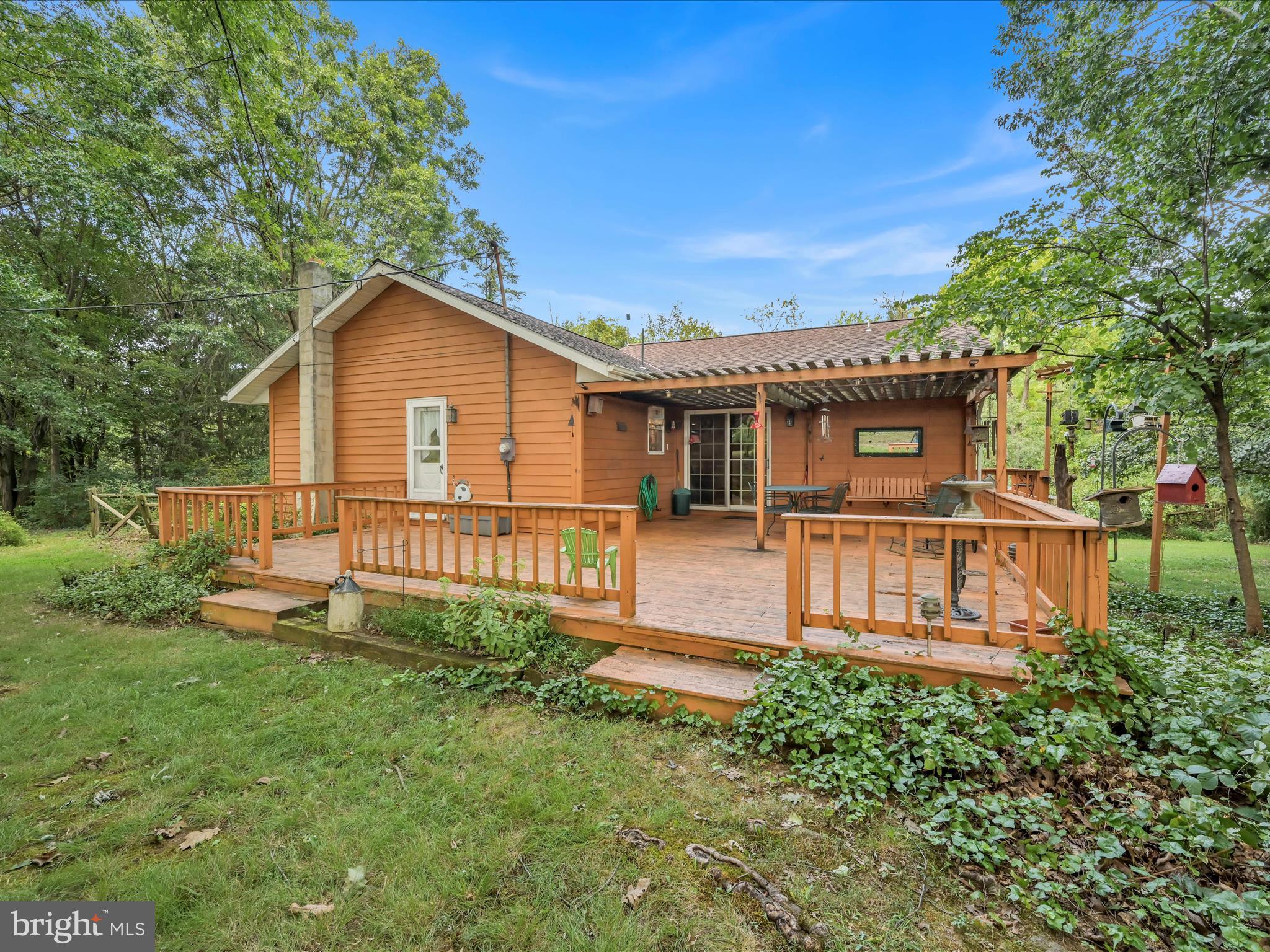 321 Wolf Creek Road Bernville, PA 19506 - Photo 11 of 49 a view of a house with a yard and sitting area