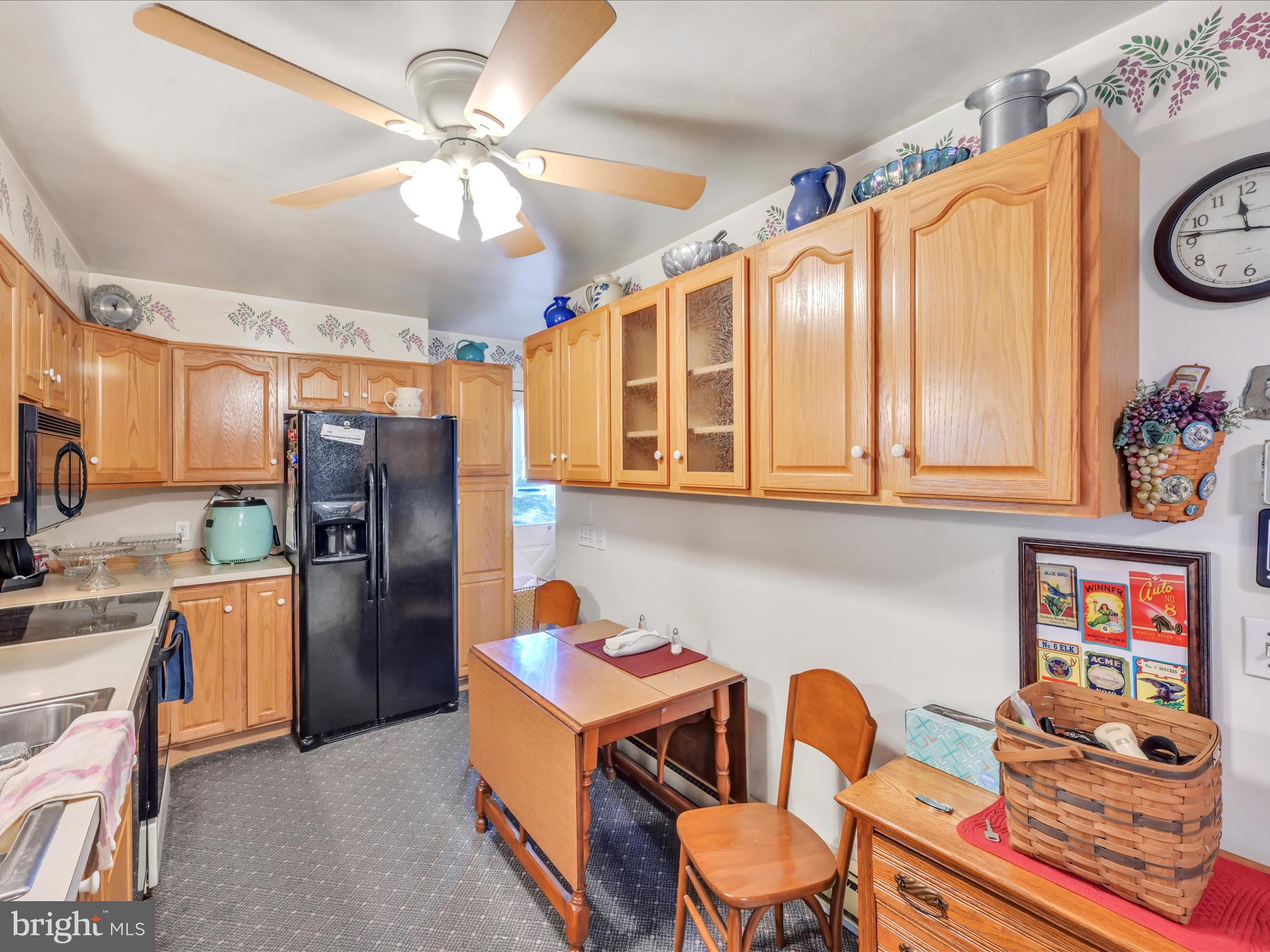 321 Wolf Creek Road Bernville, PA 19506 - Photo 20 of 49 a kitchen with a refrigerator and furniture