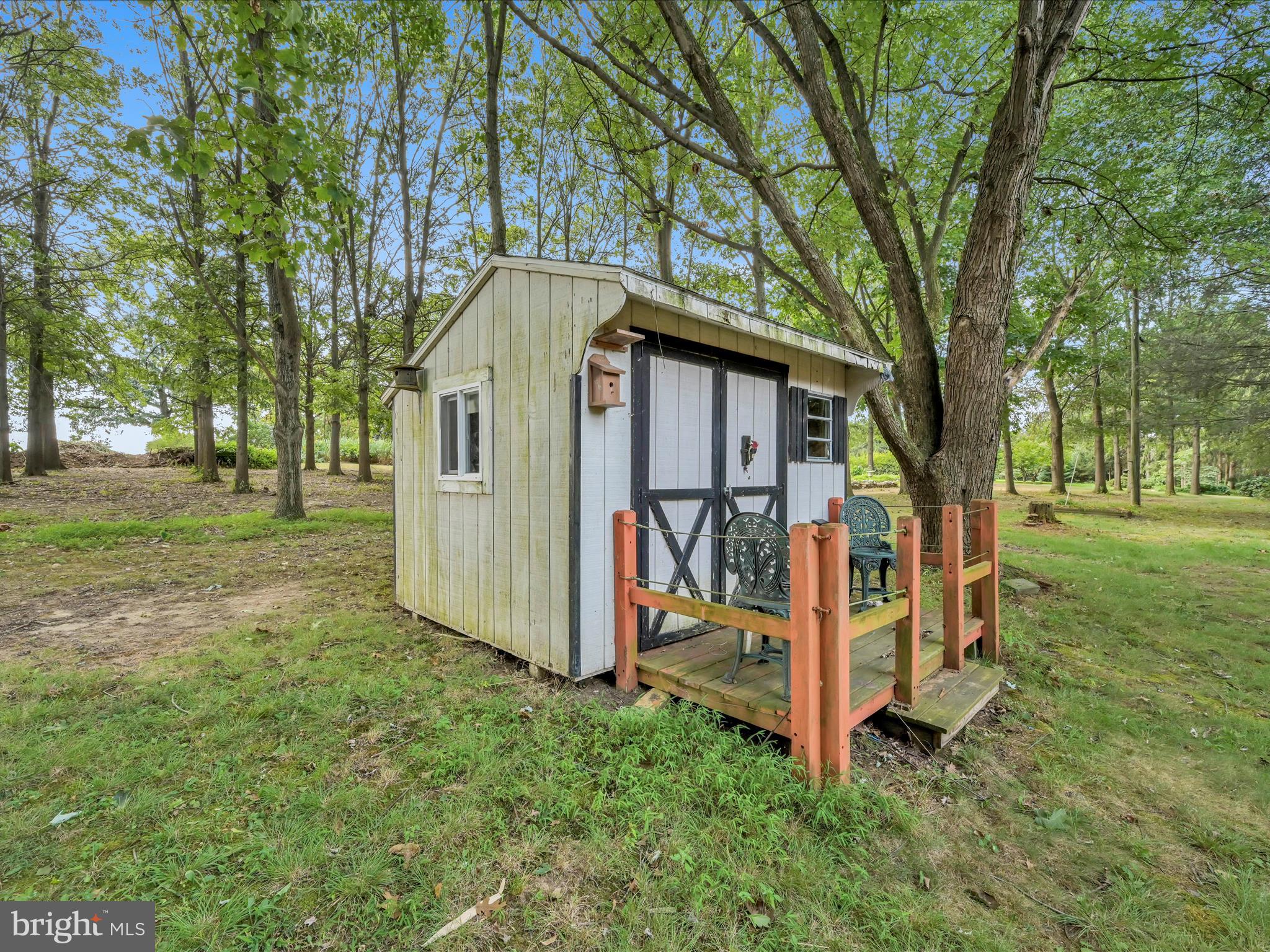 321 Wolf Creek Road Bernville, PA 19506 - Photo 41 of 49 a view of a small house with a big yard and large trees