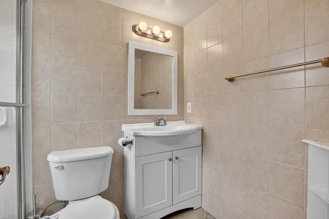 a dining room with furniture and a floor to ceiling window