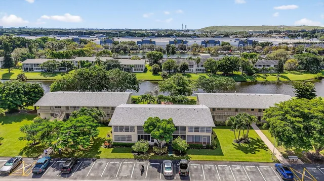 an aerial view of a house with a garden and plants