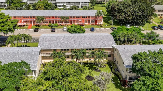 a view of a swimming pool with a yard