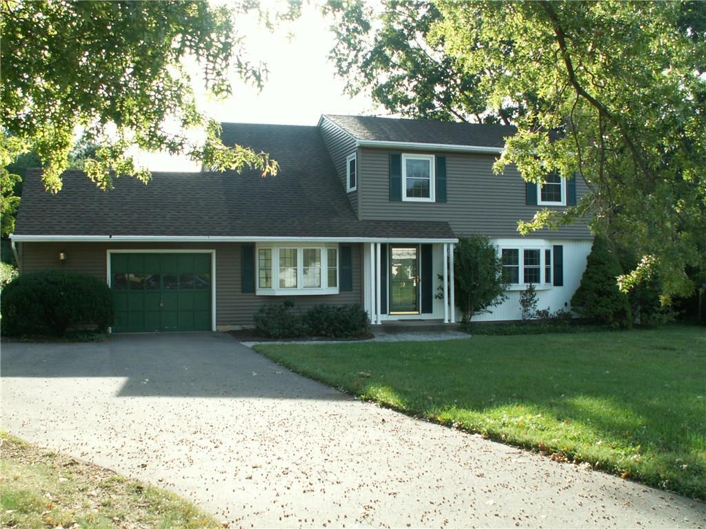a view front of house with yard and green space