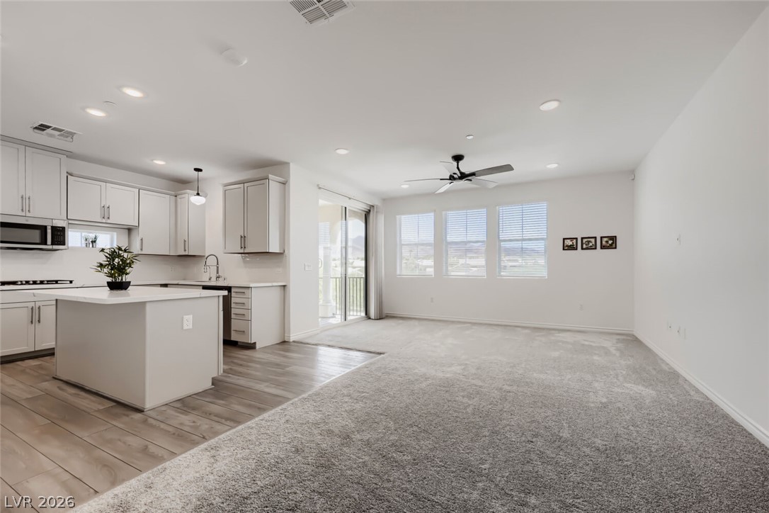 2555 Hampton Road, Unit 9301 Henderson, NV 89052 - Photo 6 of 36 An open-concept great room and kitchen flow seamlessly with an abundance of natural light.