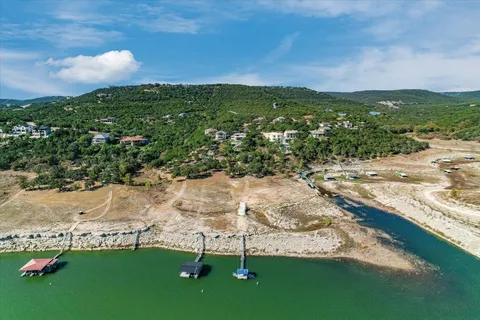 a view of a lake with a yard
