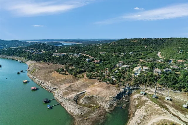 a view of a city with lush green forest