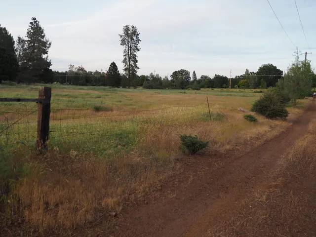 a view of a road with an outdoor space