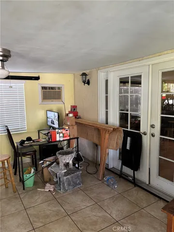 a room with furniture and musical instruments