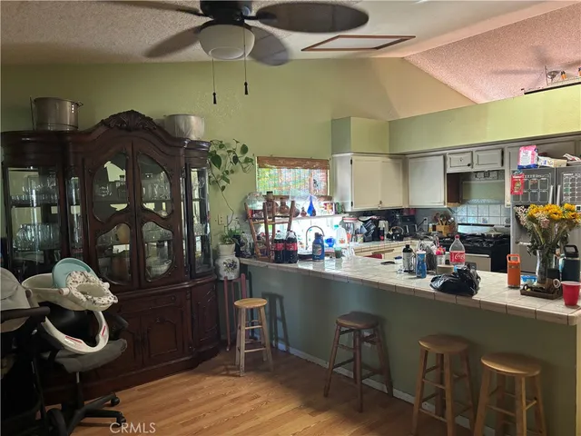 a kitchen with stainless steel appliances granite countertop a sink and cabinets