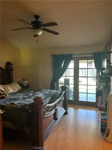 a bed sitting in a room next to a window