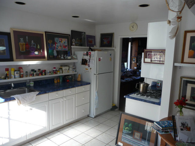 441 Brighton Road Pacifica, CA 94044 - Photo 4 of 18 a kitchen with stainless steel appliances a refrigerator and a stove top oven
