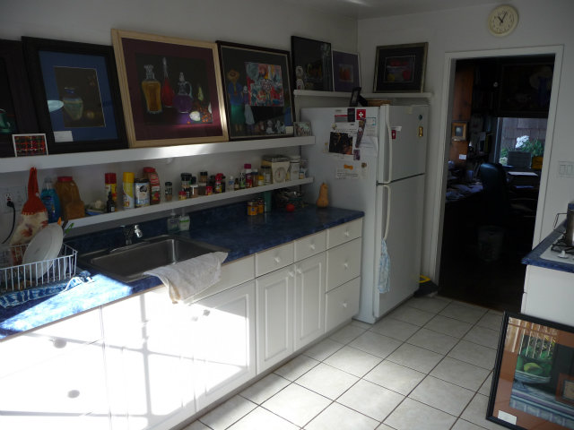 441 Brighton Road Pacifica, CA 94044 - Photo 5 of 18 a kitchen with stainless steel appliances kitchen island granite countertop a refrigerator and a stove top oven