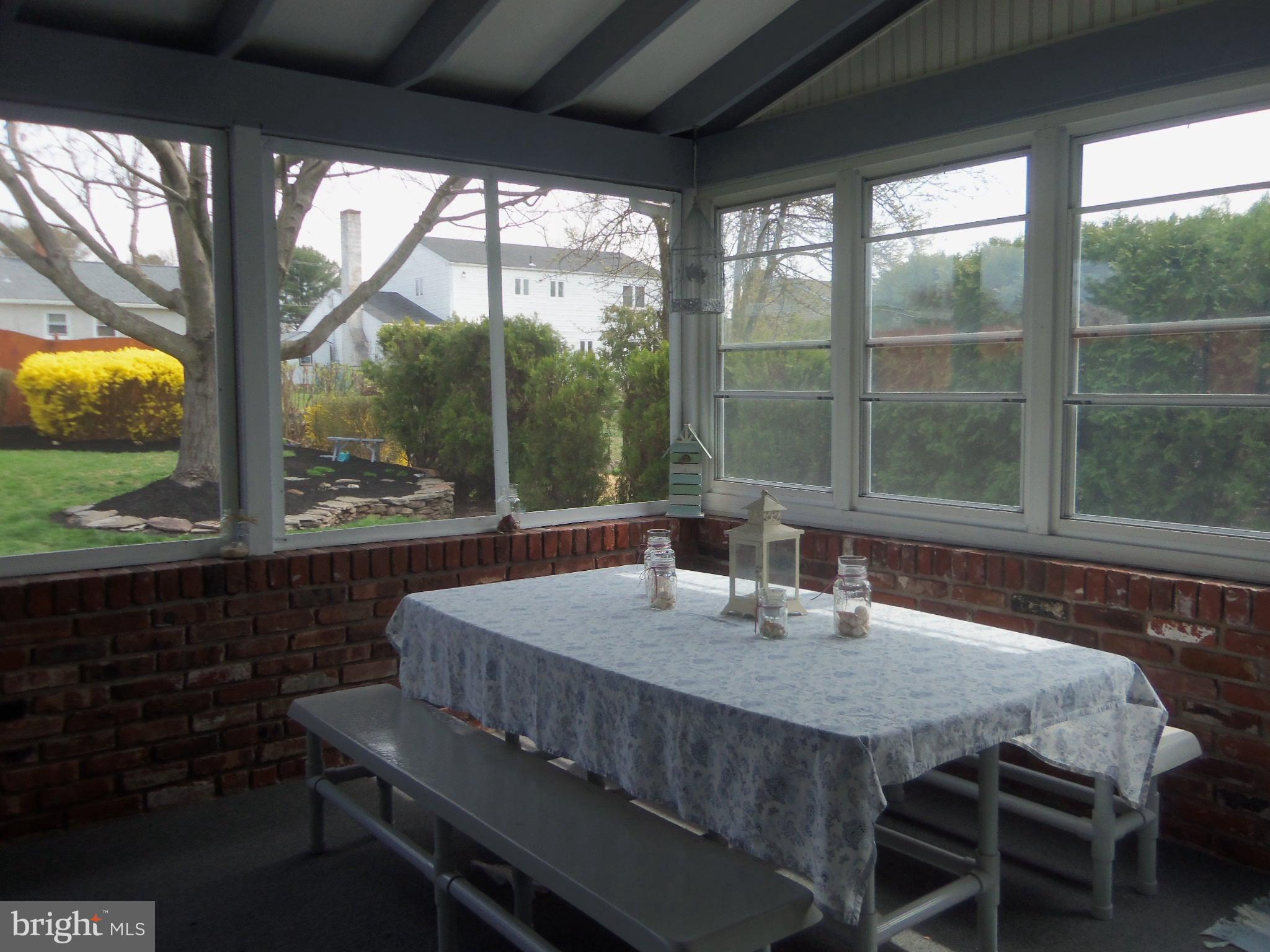 915 Phillips Road Warminster, PA 18974 - Photo 31 of 36 Screened Porch Eating Area