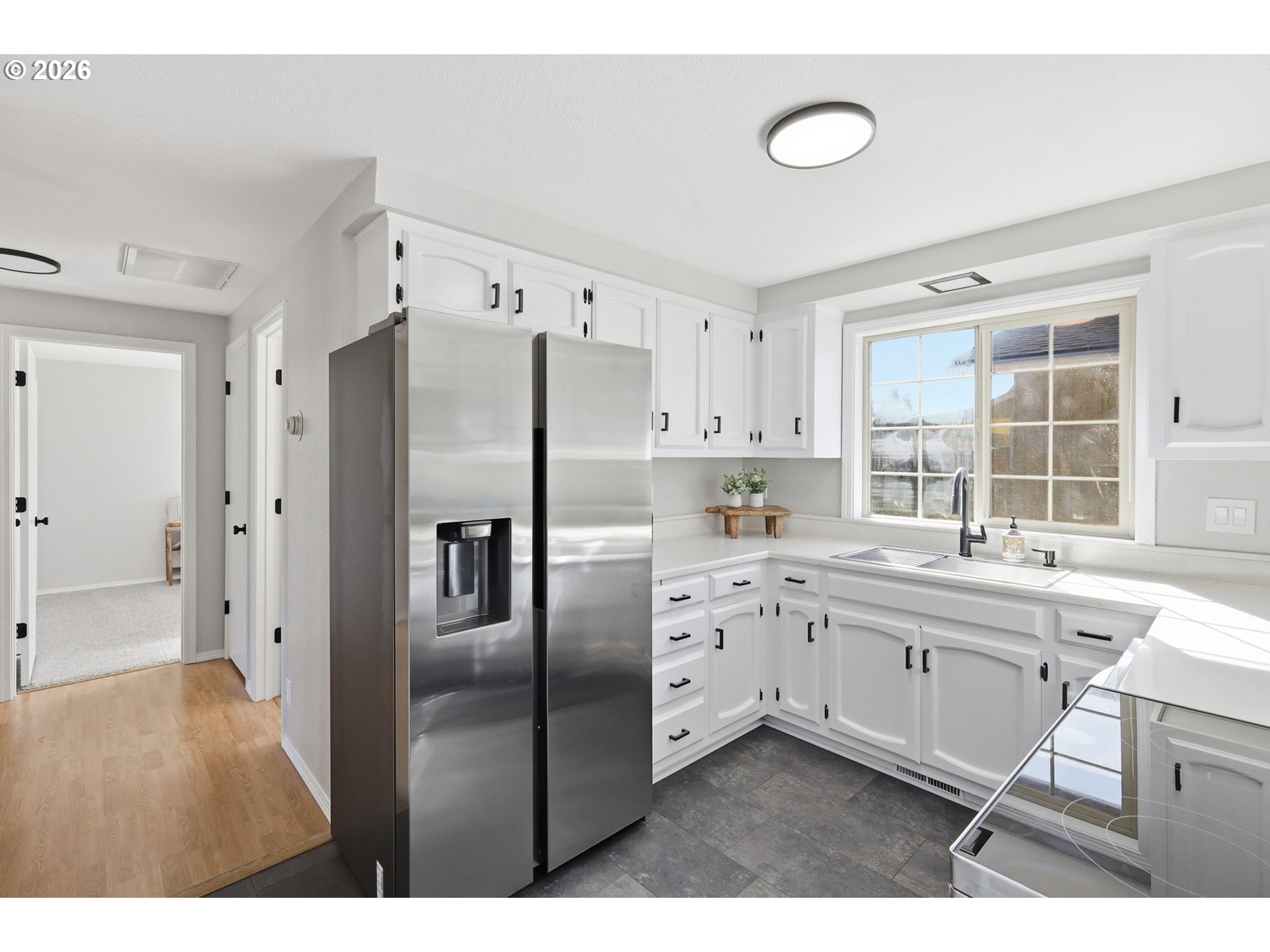 1467 South 7th Street Cottage Grove, OR 97424 - Photo 15 of 48 a kitchen with stainless steel appliances a refrigerator sink and cabinets