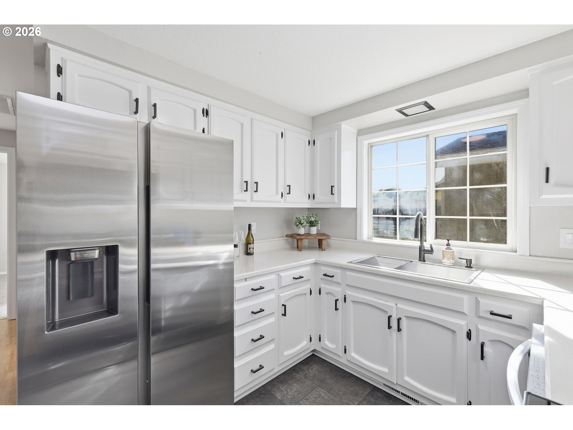 1467 South 7th Street Cottage Grove, OR 97424 - Photo 18 of 48 a kitchen with a sink window and refrigerator