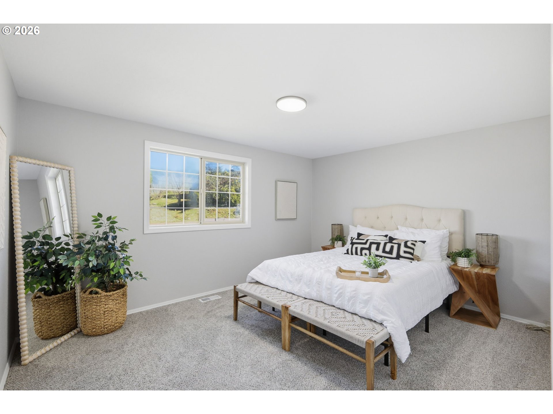1467 South 7th Street Cottage Grove, OR 97424 - Photo 19 of 48 a bedroom with a bed and a potted plant