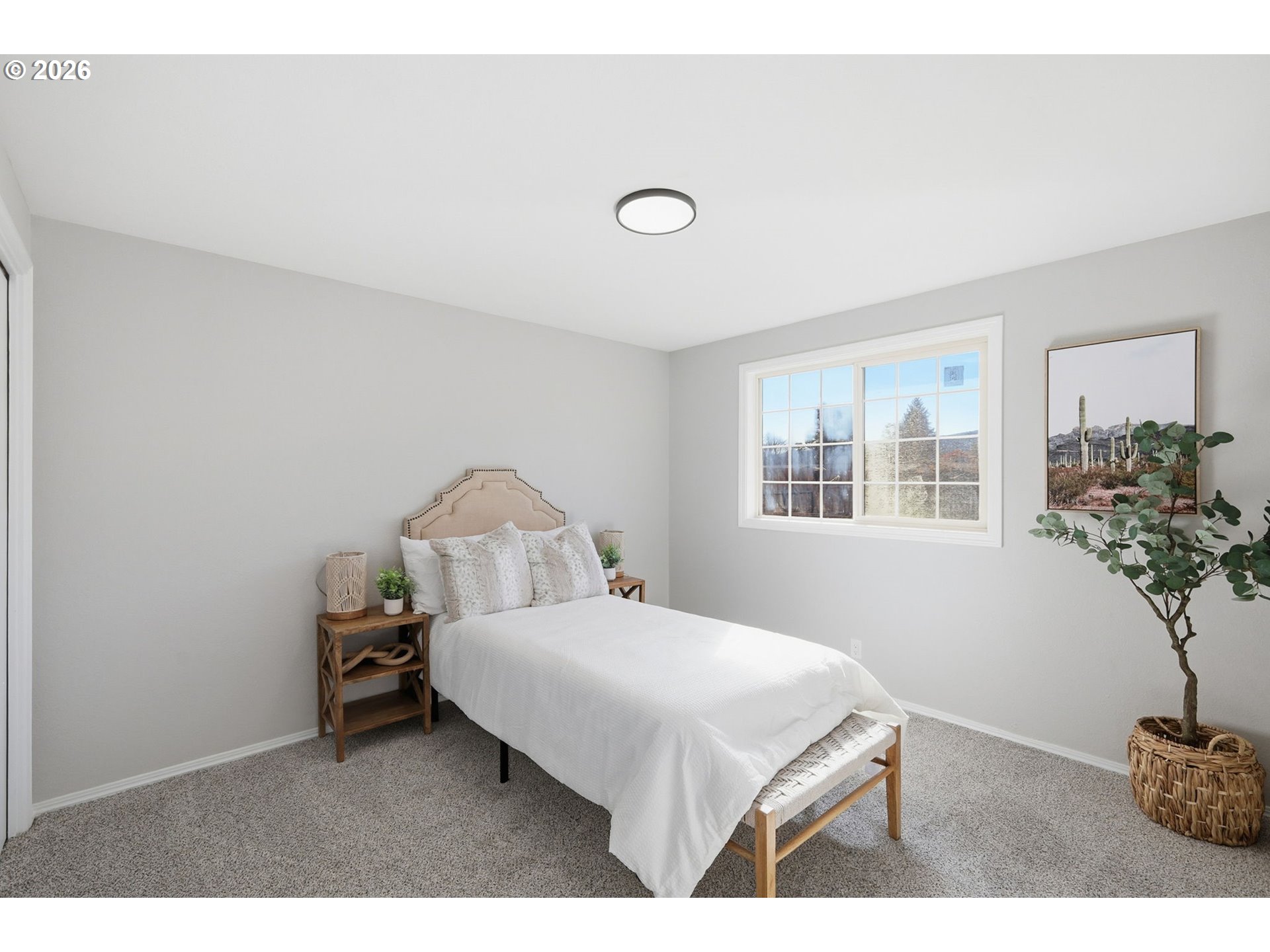 1467 South 7th Street Cottage Grove, OR 97424 - Photo 21 of 48 a bedroom with a bed and a potted plant
