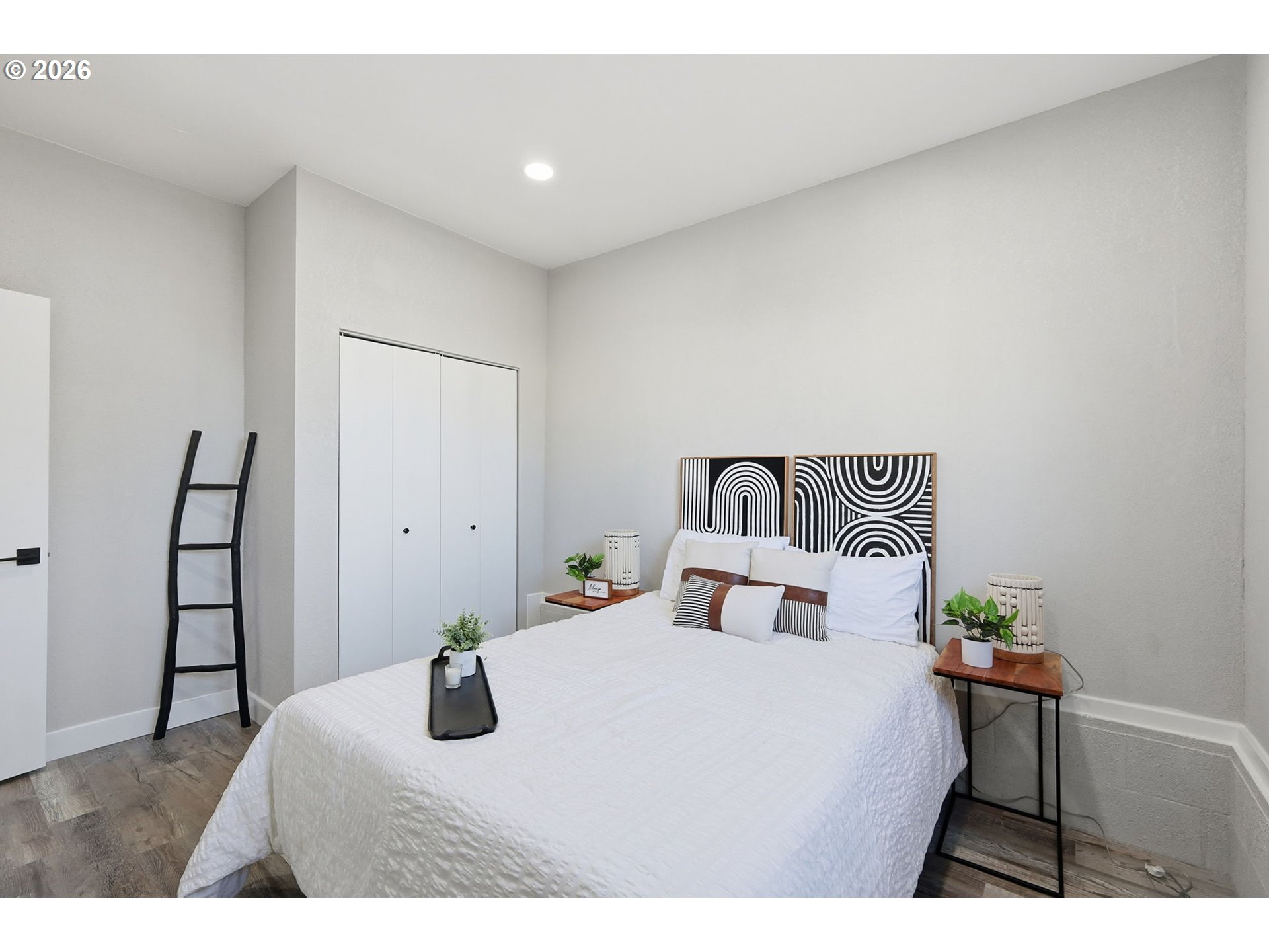 1467 South 7th Street Cottage Grove, OR 97424 - Photo 27 of 48 a bedroom with a bed and a painting on the wall