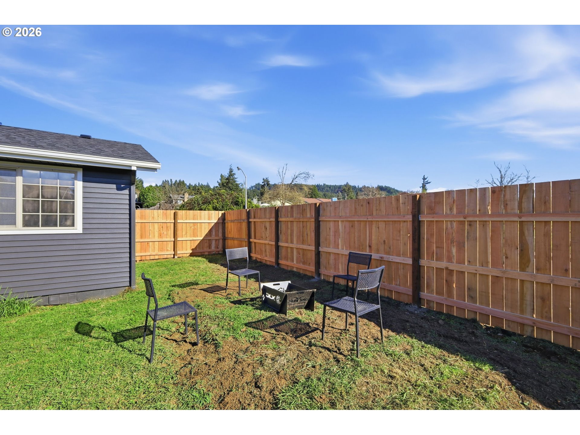 1467 South 7th Street Cottage Grove, OR 97424 - Photo 29 of 48 a view of a backyard with sitting area