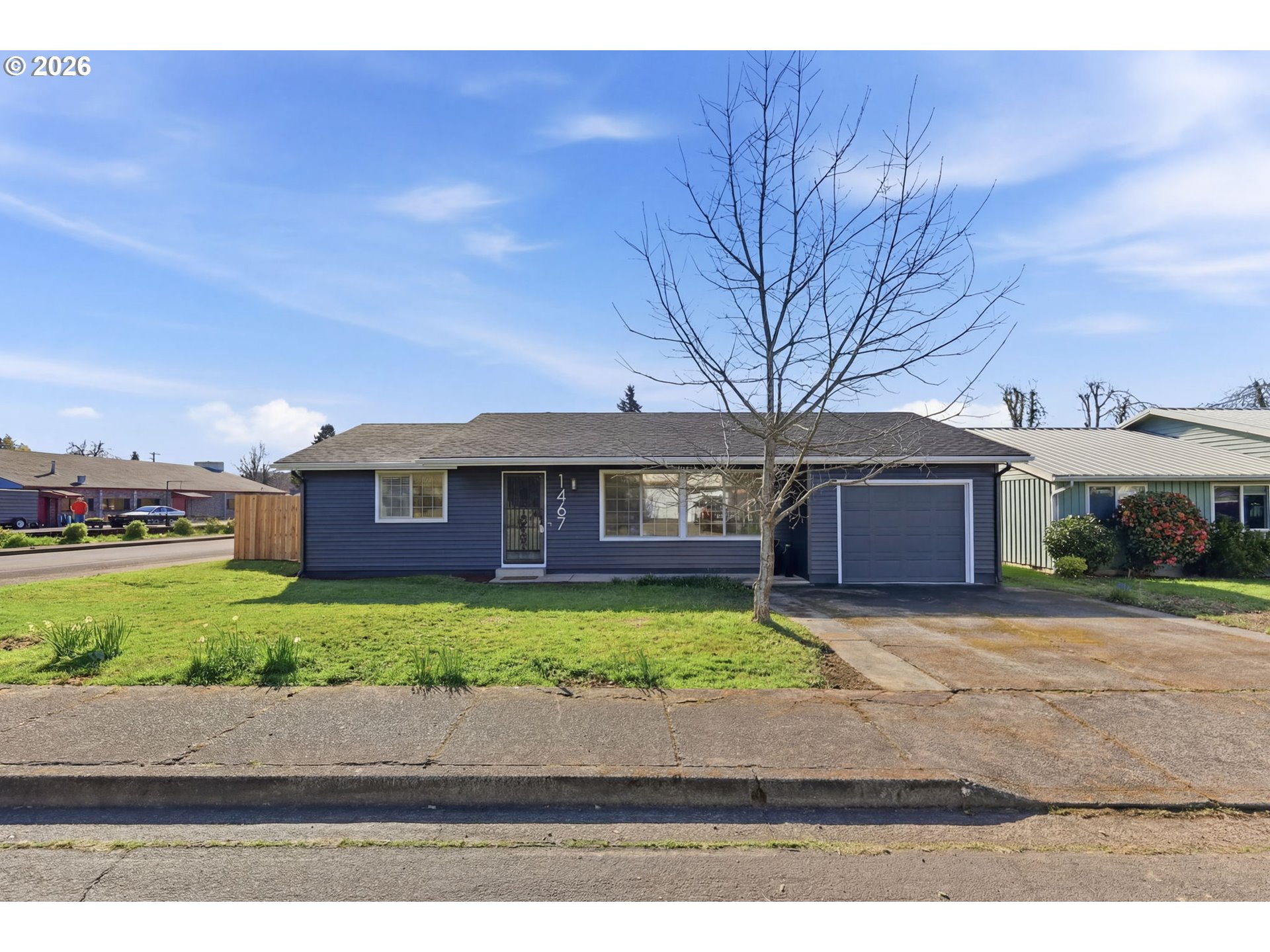 1467 South 7th Street Cottage Grove, OR 97424 - Photo 3 of 48 a front view of a house with garden