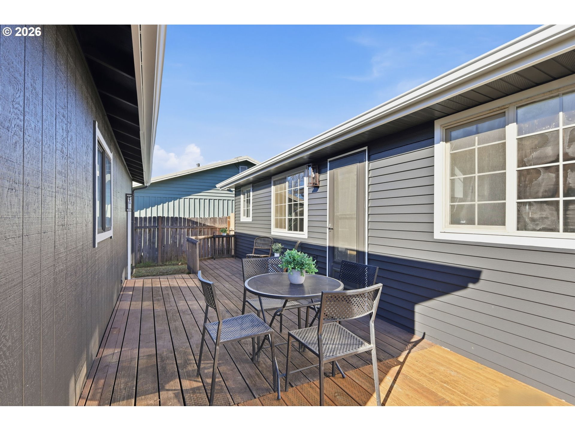 1467 South 7th Street Cottage Grove, OR 97424 - Photo 33 of 48 a balcony with table and chairs