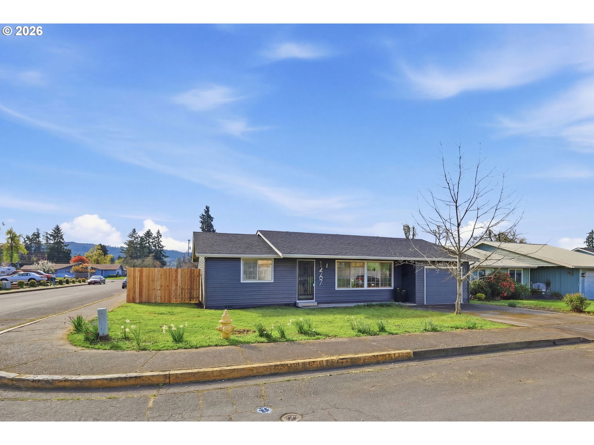1467 South 7th Street Cottage Grove, OR 97424 - Photo 41 of 48 a front view of house with yard and green space
