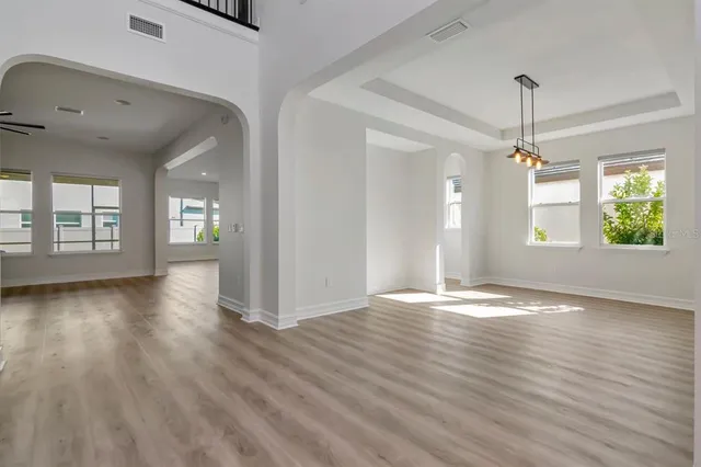 a view of a kitchen with a sink stainless steel appliances and cabinets