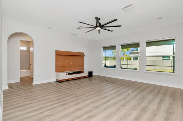 a living room with furniture and kitchen view