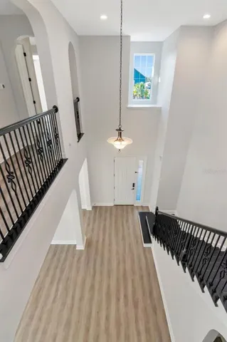 a bathroom with a tub a double vanity sink and a mirror