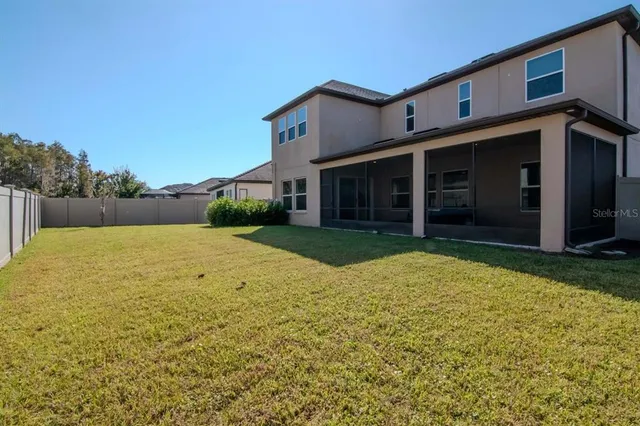 a view of multiple house with a yard