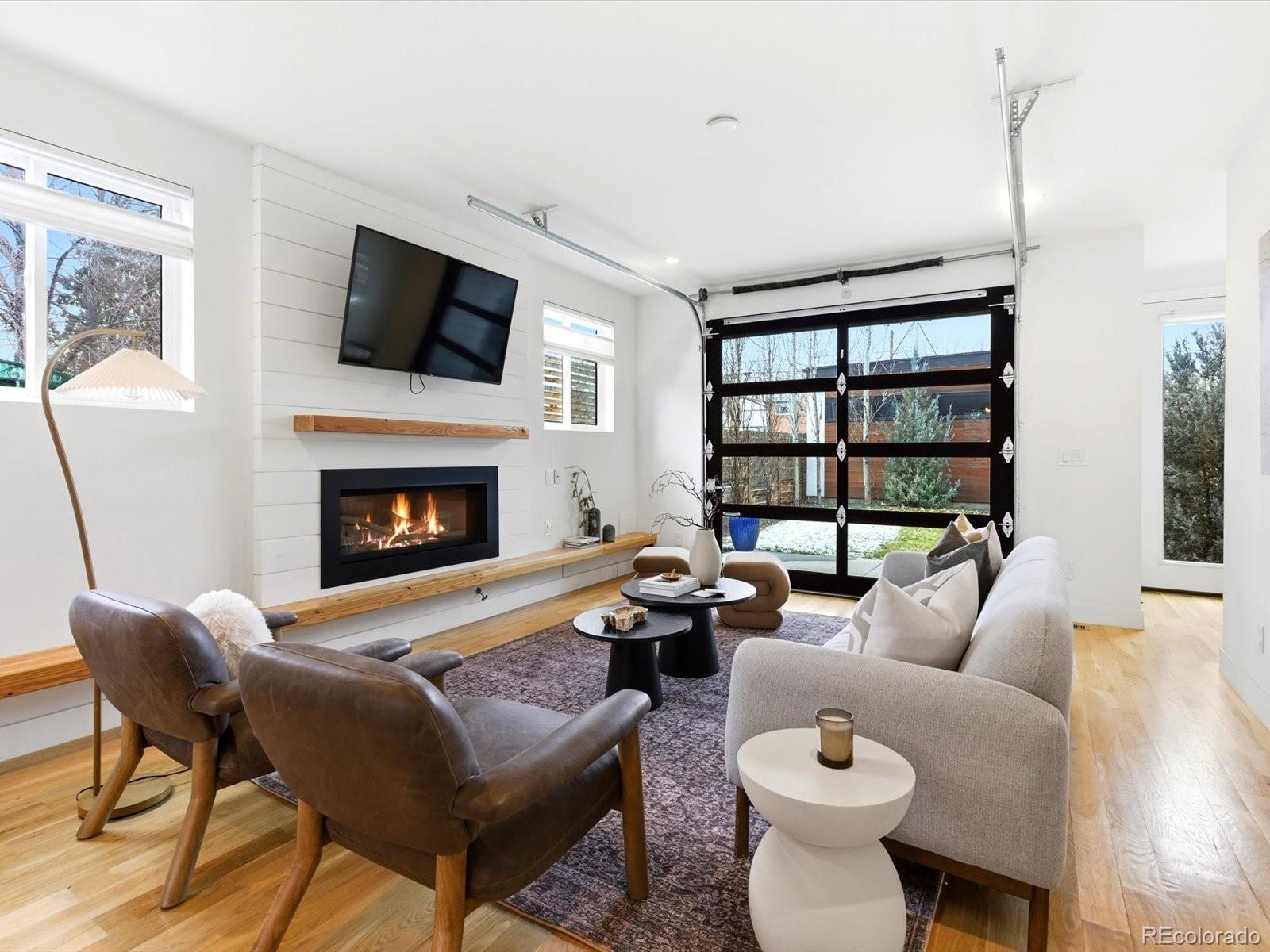 4141 Shoshone Street Denver, CO 80211 - Photo 11 of 50 a living room with furniture and a fireplace