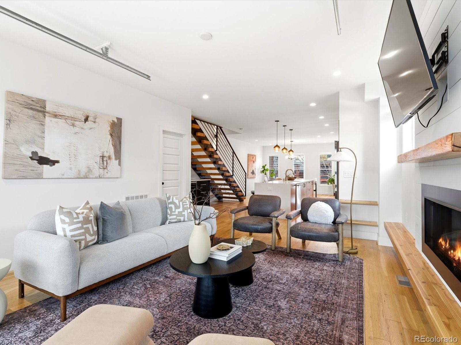 4141 Shoshone Street Denver, CO 80211 - Photo 12 of 50 a living room with furniture and a fireplace