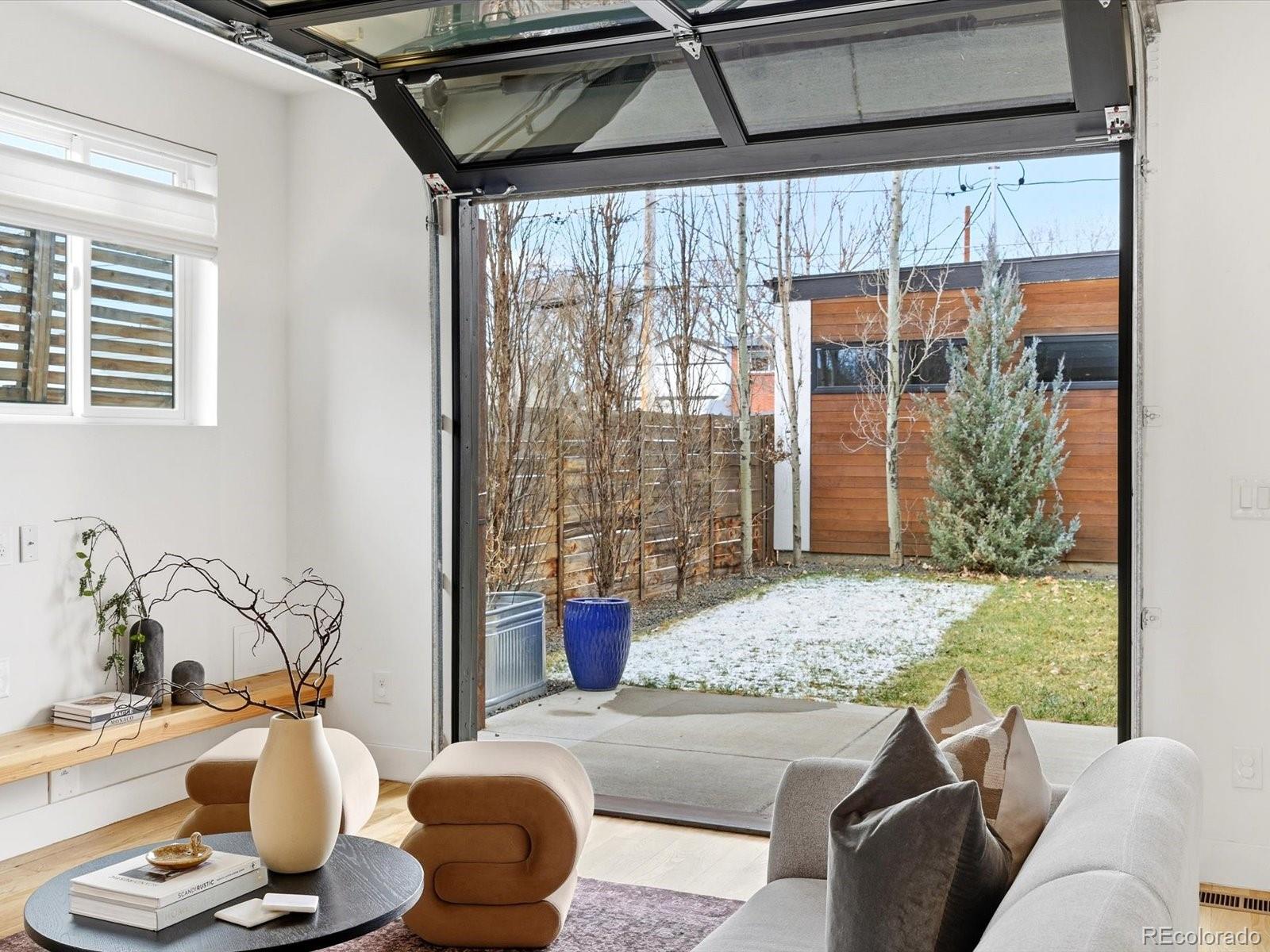4141 Shoshone Street Denver, CO 80211 - Photo 19 of 50 a living room with furniture and a window