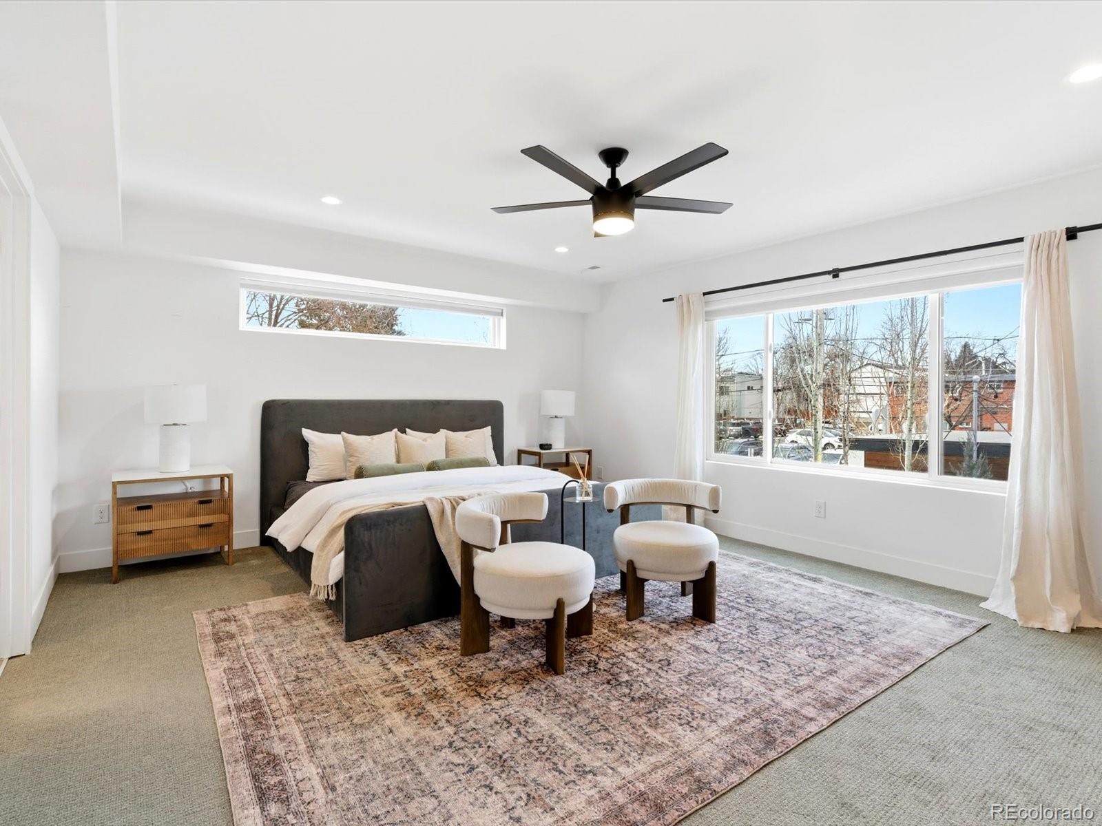 4141 Shoshone Street Denver, CO 80211 - Photo 22 of 50 a bed room with a bed and a chair