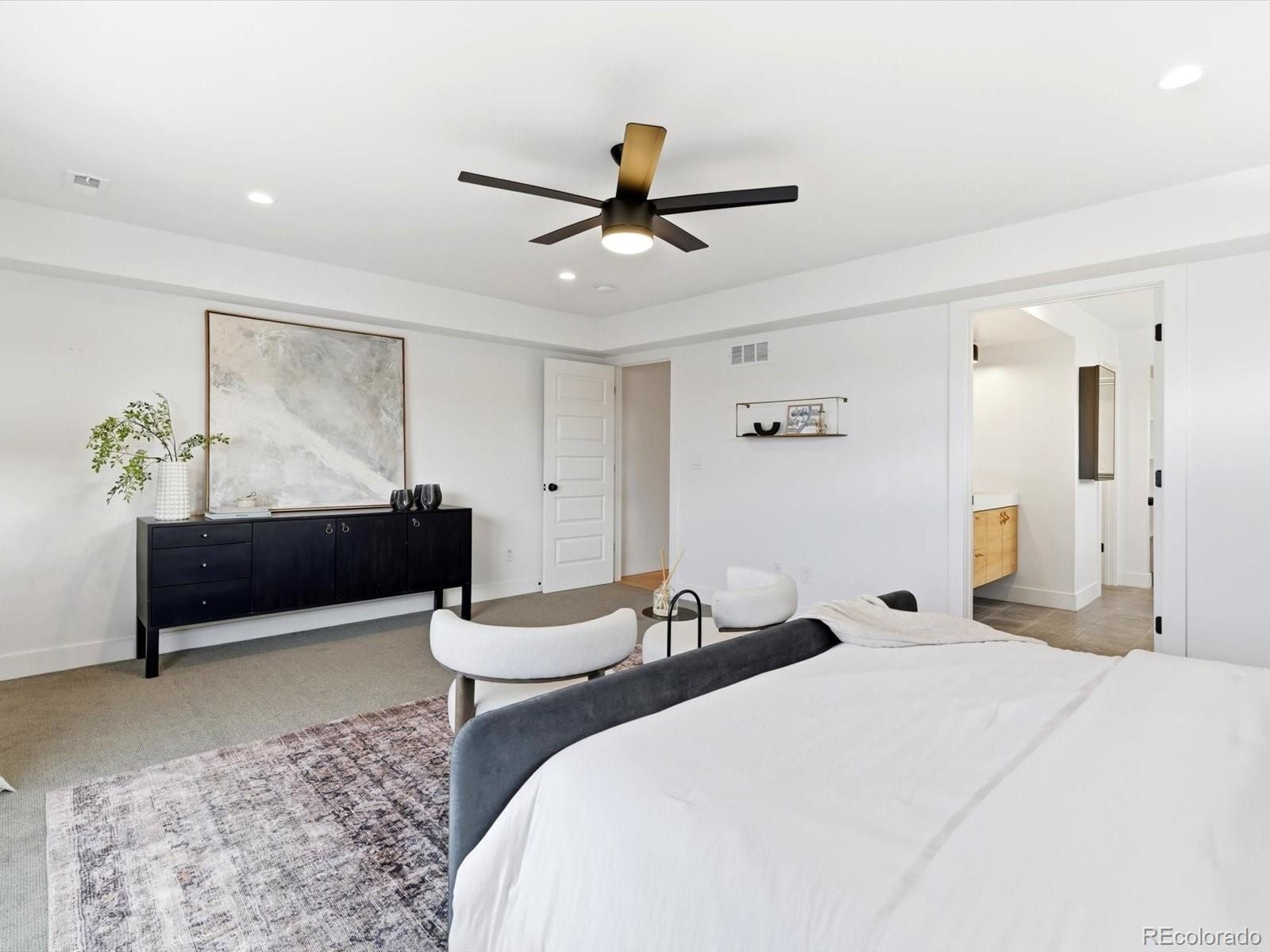 4141 Shoshone Street Denver, CO 80211 - Photo 23 of 50 a bedroom with a bed and ceiling fan