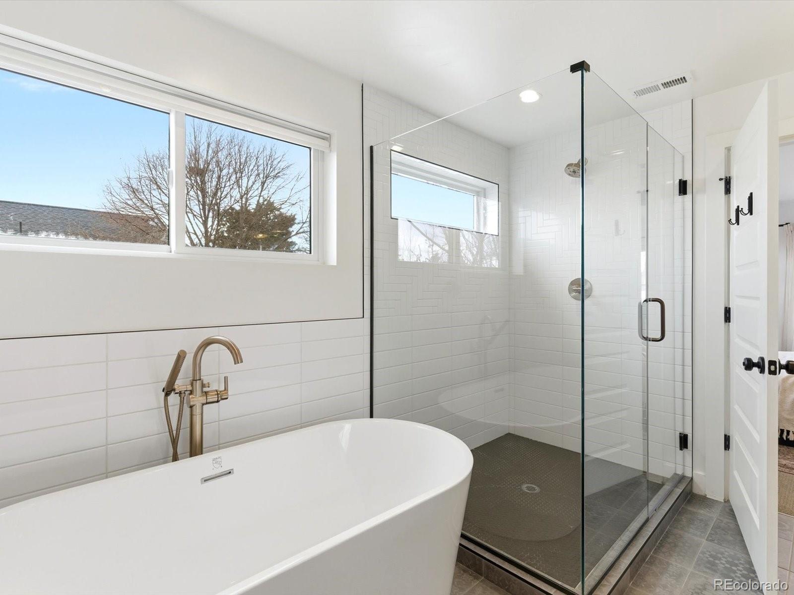 4141 Shoshone Street Denver, CO 80211 - Photo 25 of 50 a bathroom with a sink and a shower