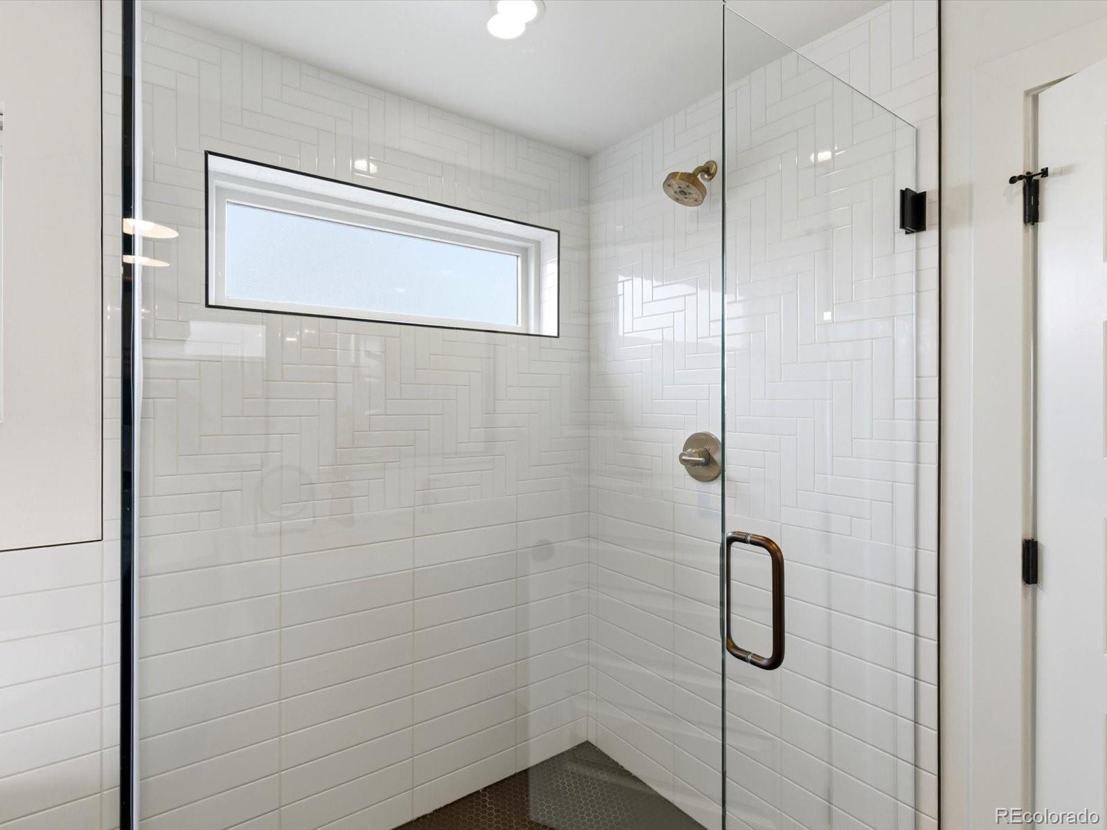 4141 Shoshone Street Denver, CO 80211 - Photo 27 of 50 a bathroom with a shower