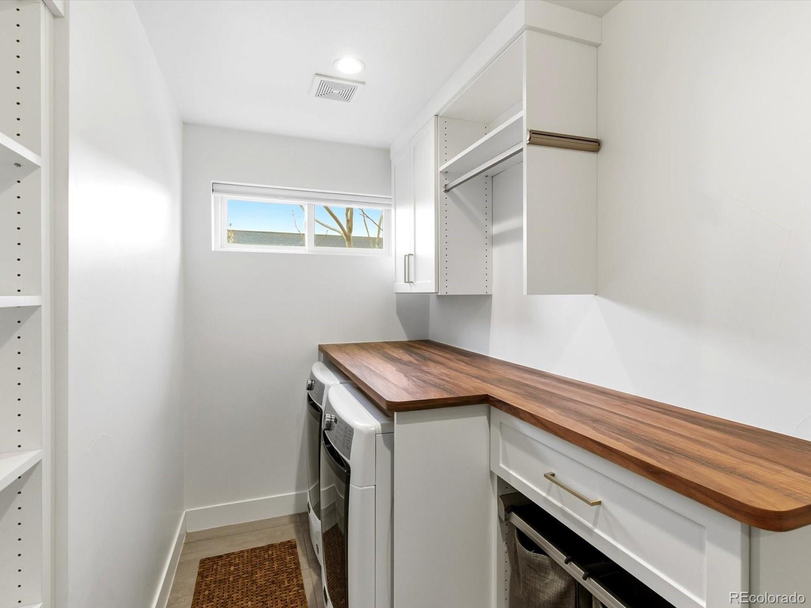 4141 Shoshone Street Denver, CO 80211 - Photo 31 of 50 a utility room with washer and dryer