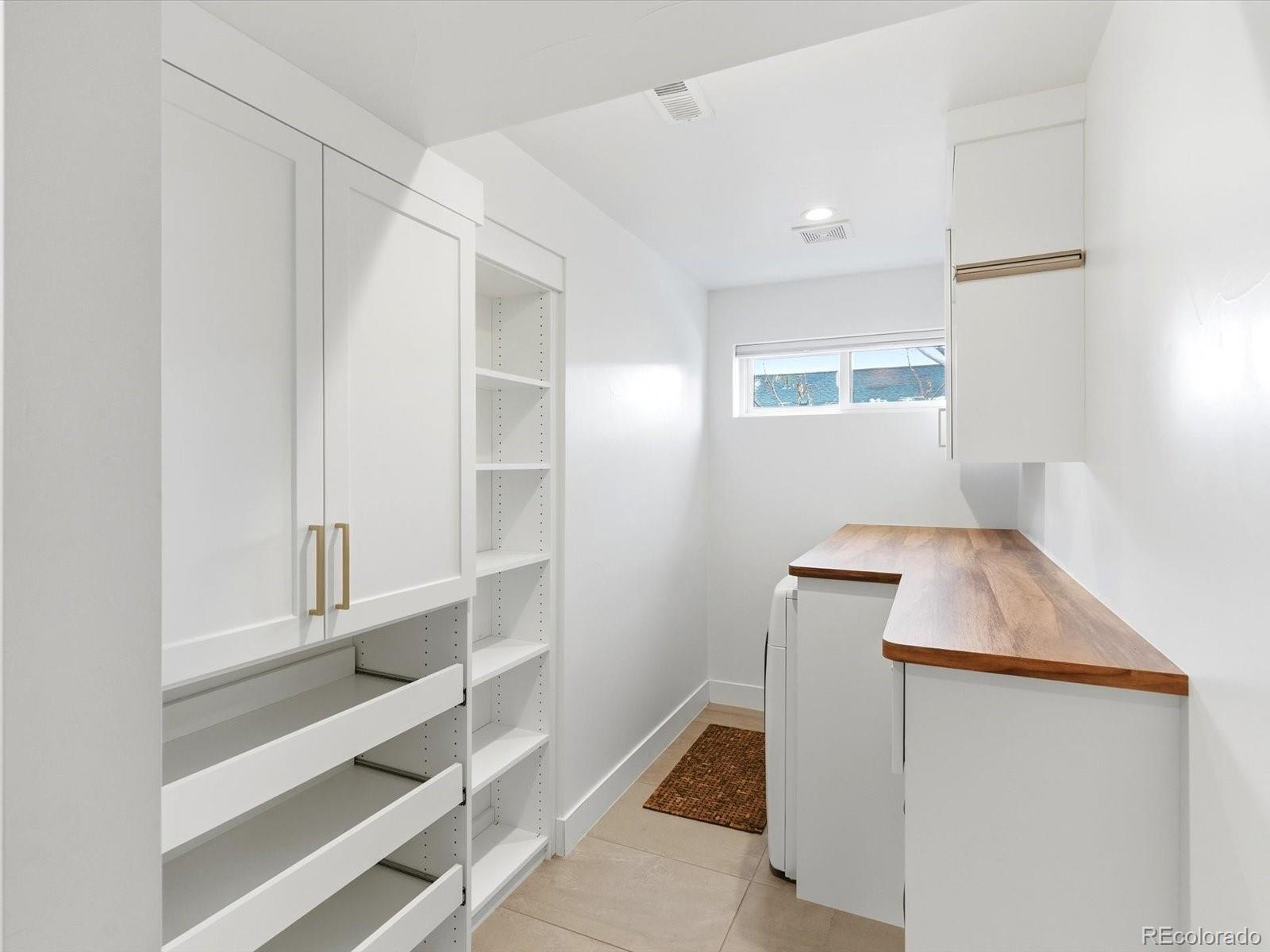 4141 Shoshone Street Denver, CO 80211 - Photo 32 of 50 a room with storage and utility