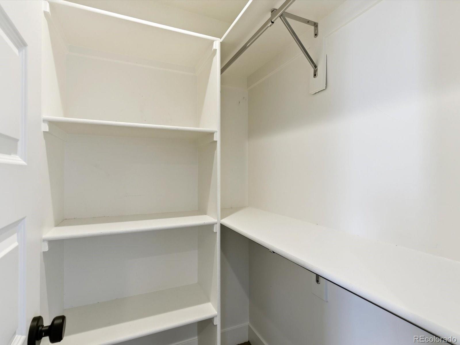 4141 Shoshone Street Denver, CO 80211 - Photo 35 of 50 a view of walk in closet with empty racks