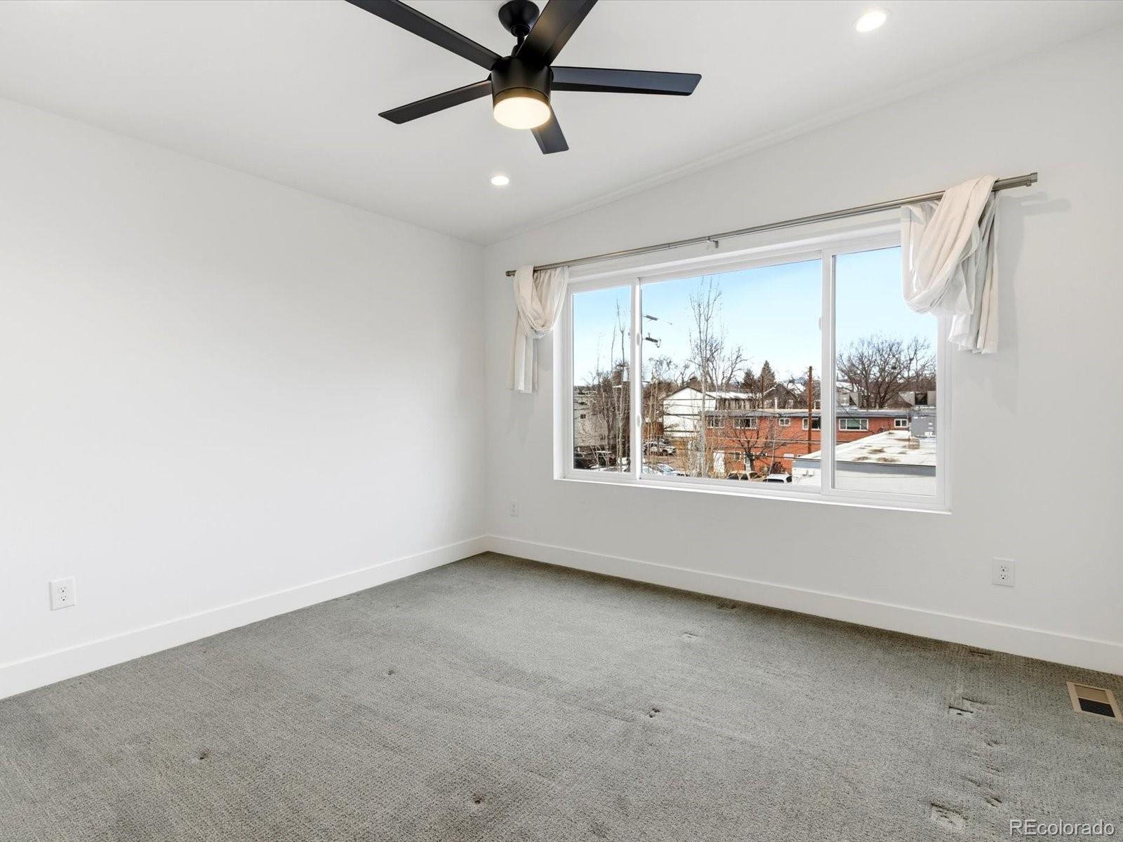 4141 Shoshone Street Denver, CO 80211 - Photo 36 of 50 a view of an empty room with a window