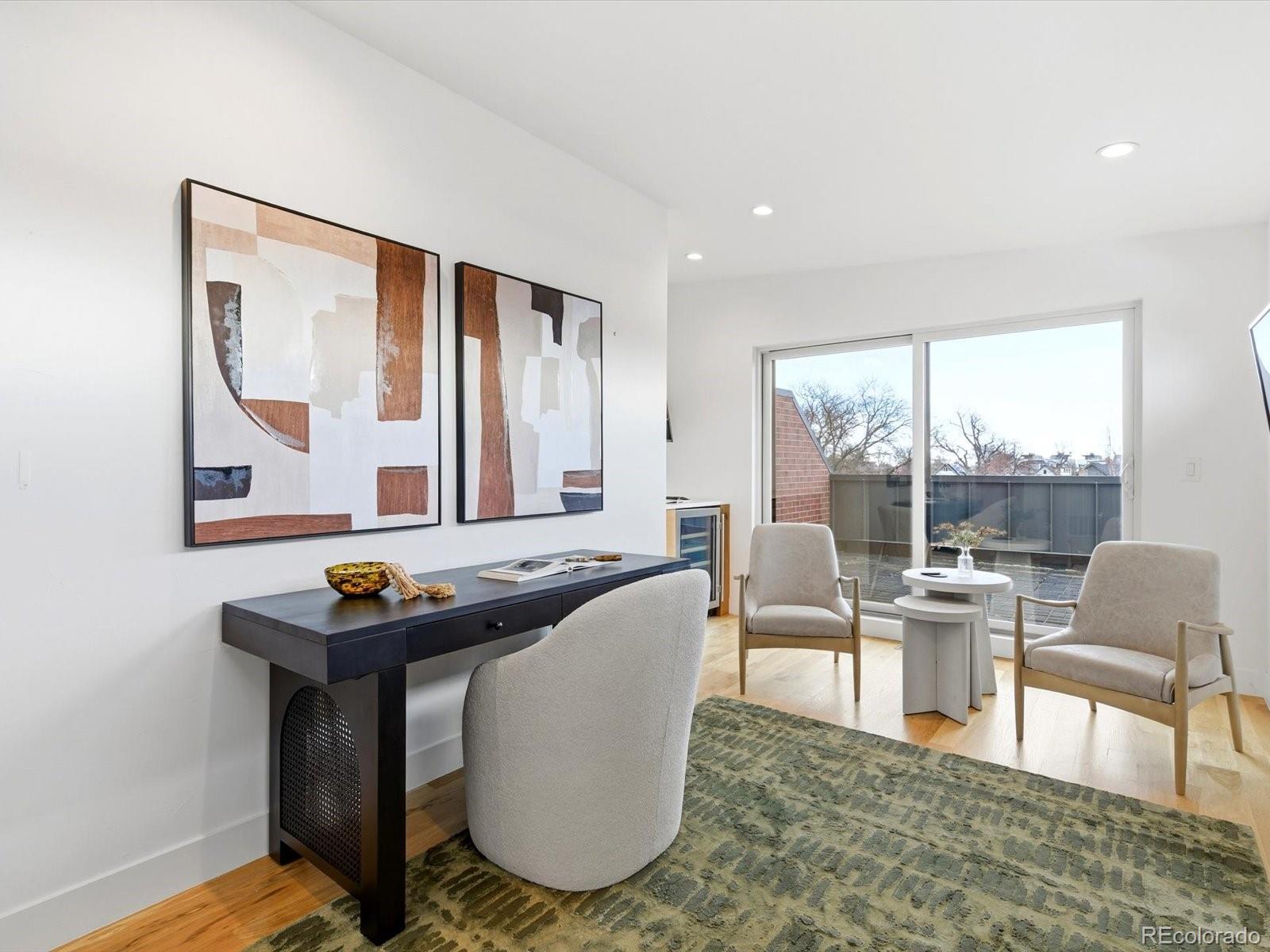 4141 Shoshone Street Denver, CO 80211 - Photo 38 of 50 a living room with furniture and a floor to ceiling window